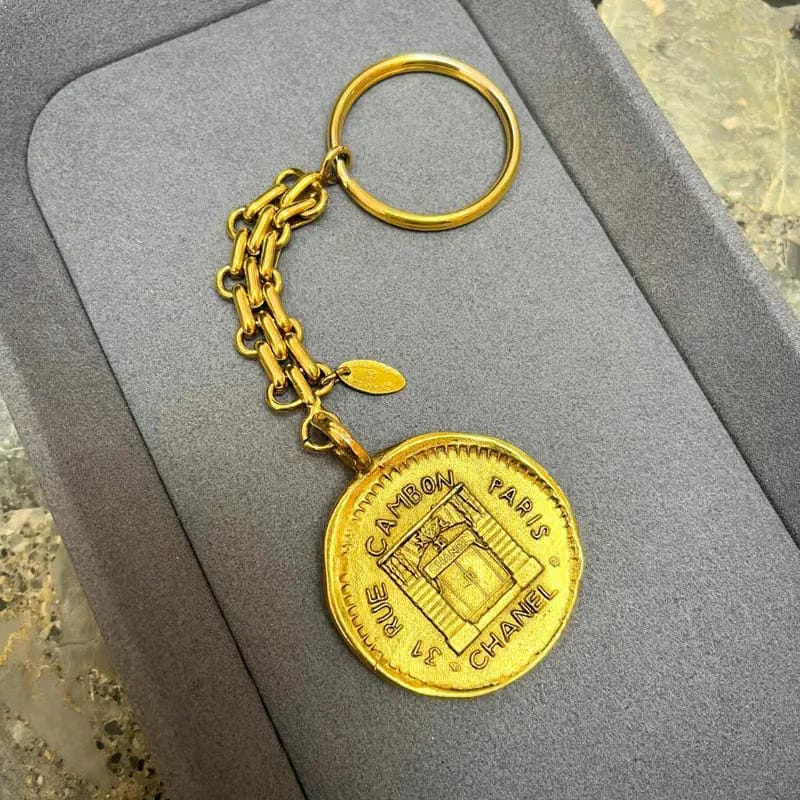 JX975 - CHANEL Vintage Gold Cambon Logo Key Ring