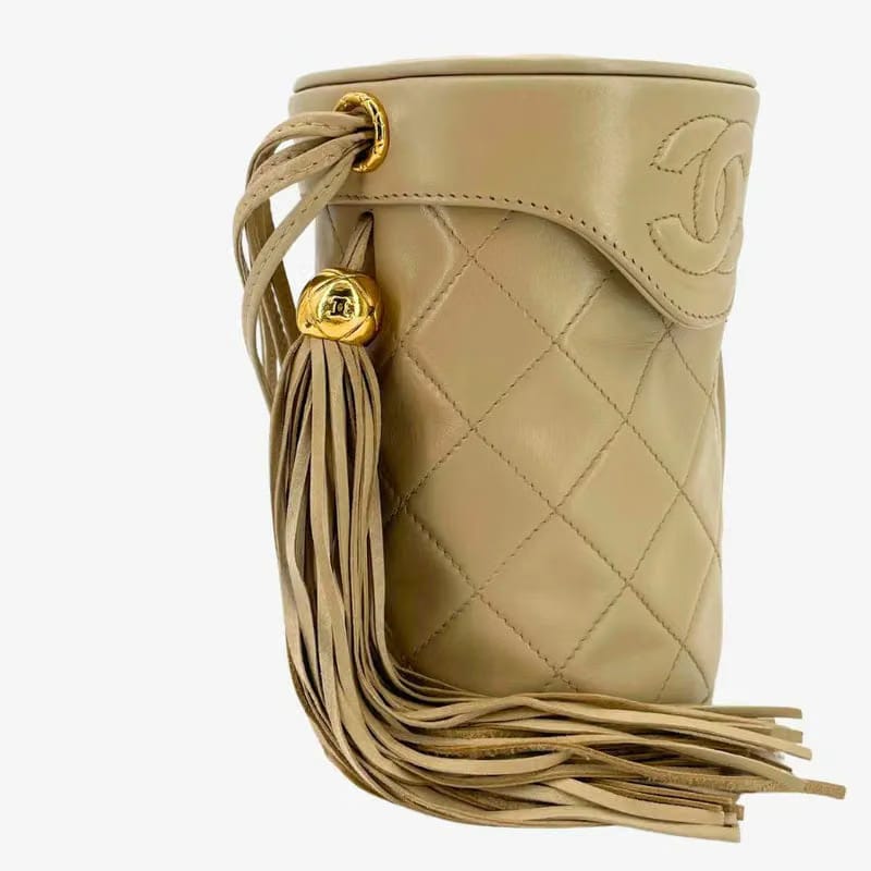 JW445 - CHANEL Vintage Beige Lambskin Cylindrical Bag