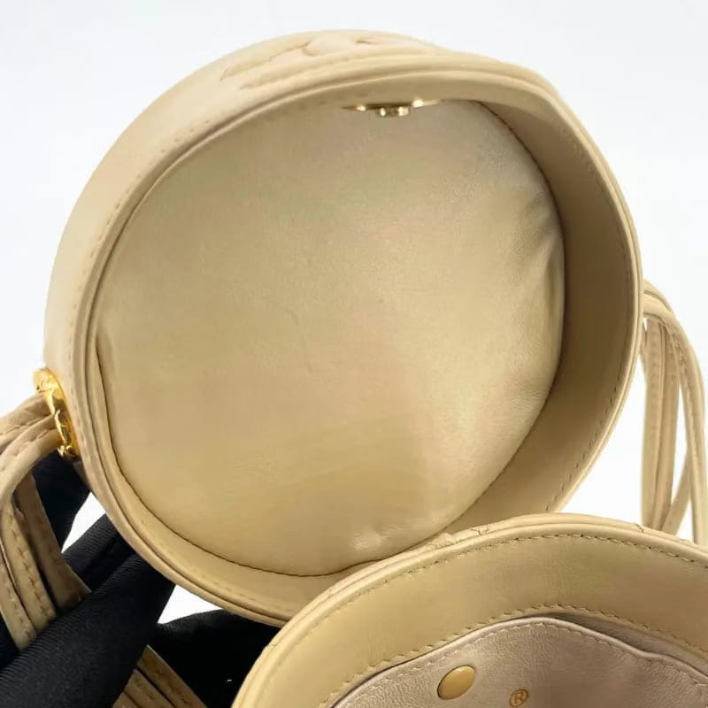 JW445 - CHANEL Vintage Beige Lambskin Cylindrical Bag