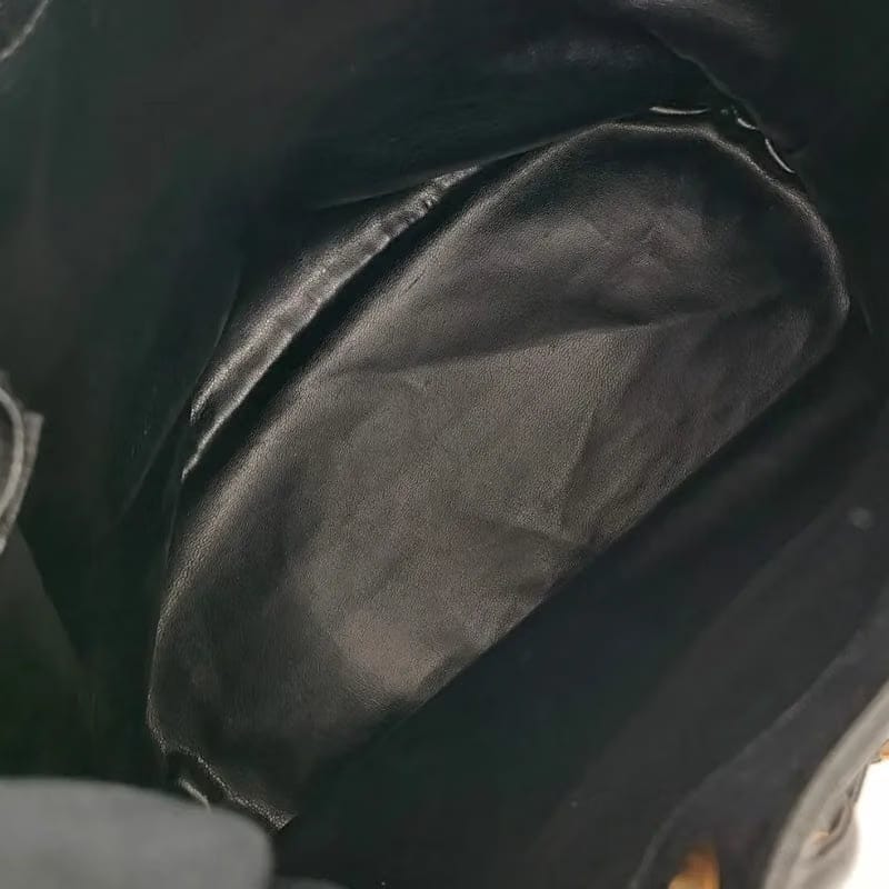RA522 - CHANEL Vintage Black Caviar Leather Gold Ball Bucket Bag