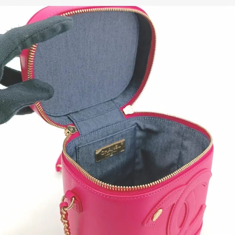 RA385 - CHANEL Pink Lambskin Vanity Case Bag