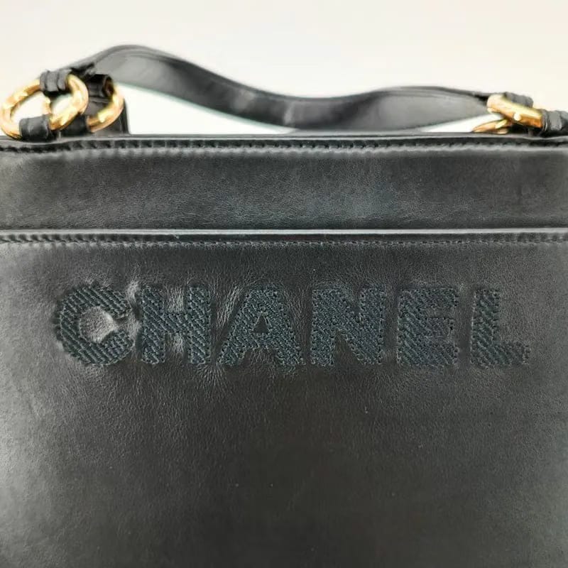 RA556 - CHANEL Vintage Black Lambskin Embroidered Logo Tote Bag