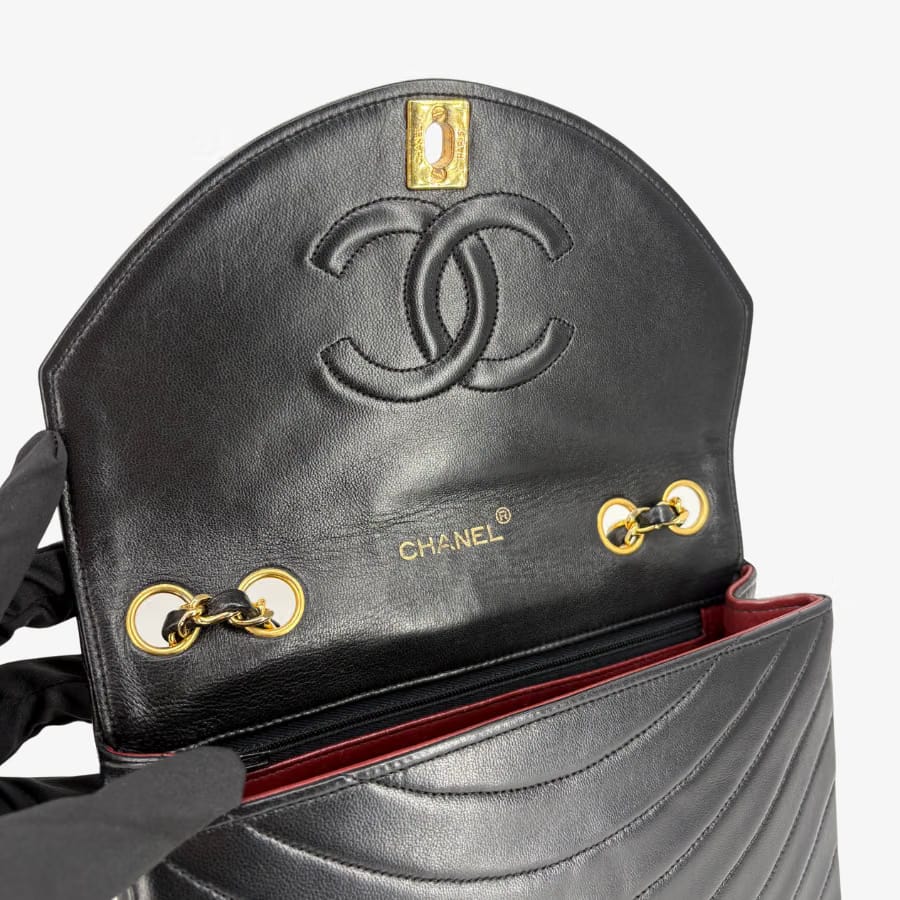 CS004 - CHANEL Vintage Black Lambskin Half Moon Wave Flap Bag