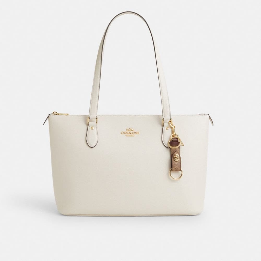 Coach Trigger Snap Bag Charm In Signature Canvas Gold Tan Brown