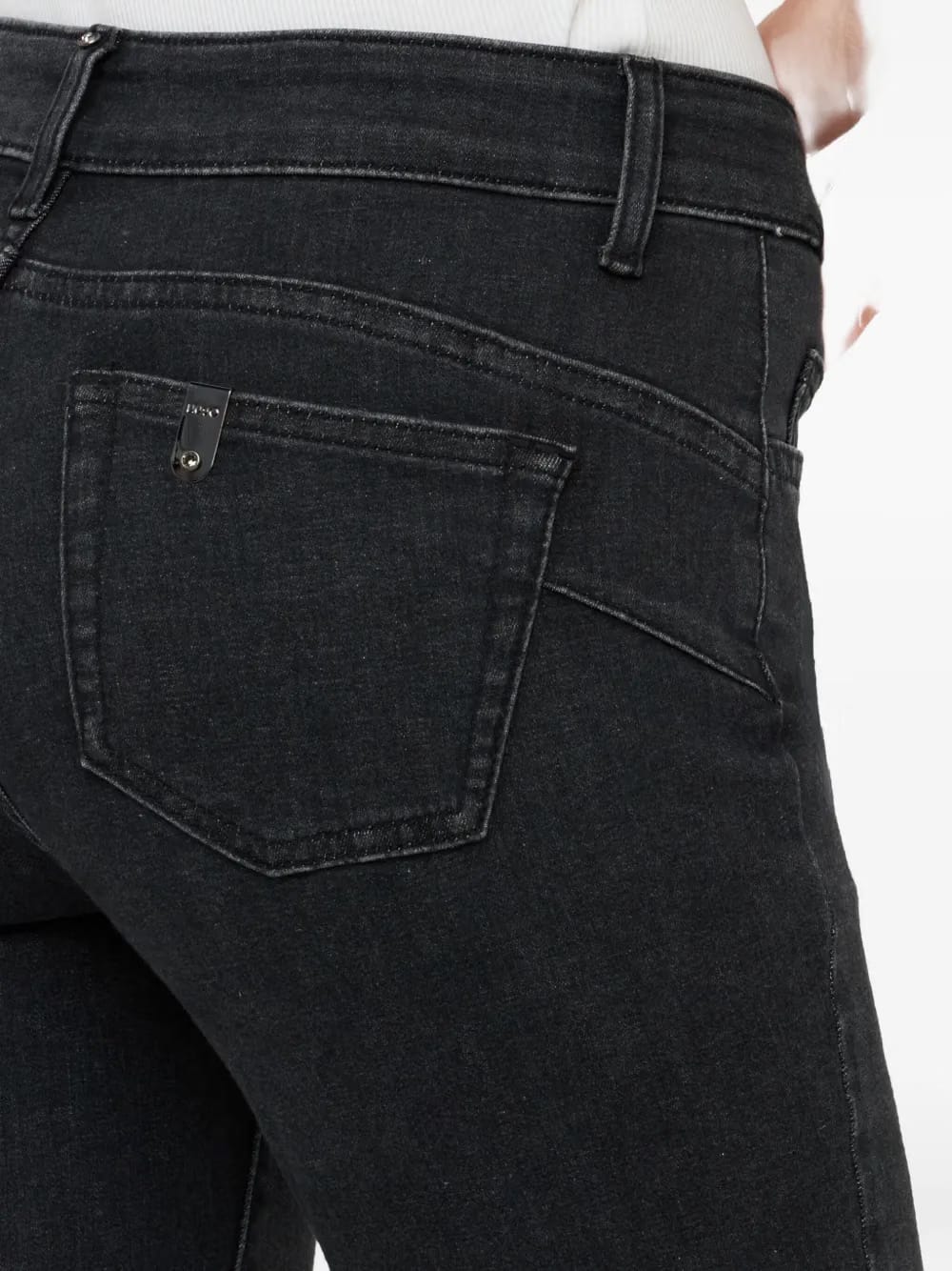 button-embellished bootcut jeans
