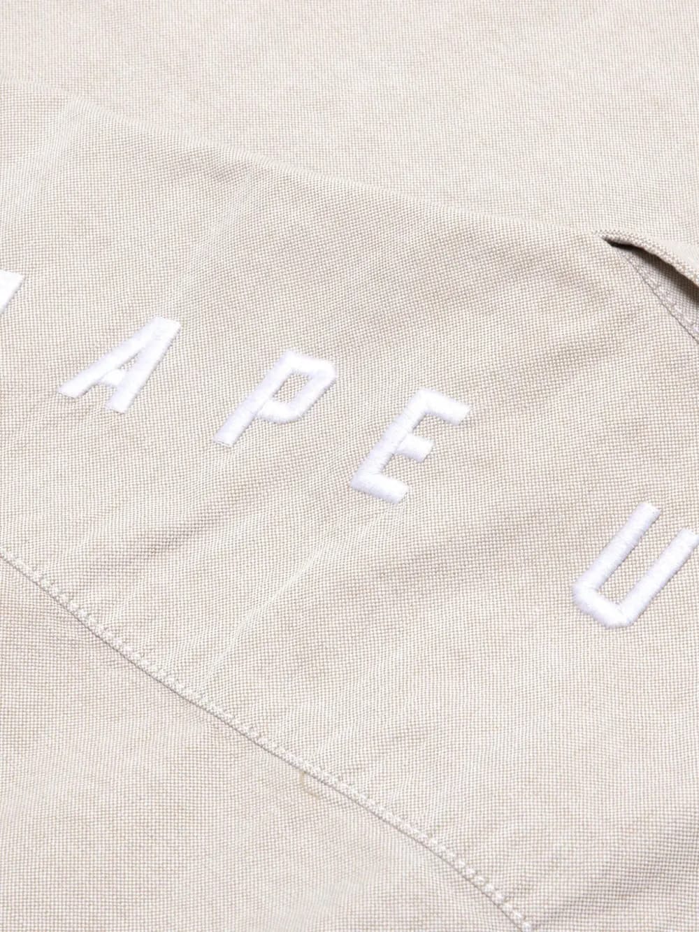 Moonface-embroidered cotton shirt