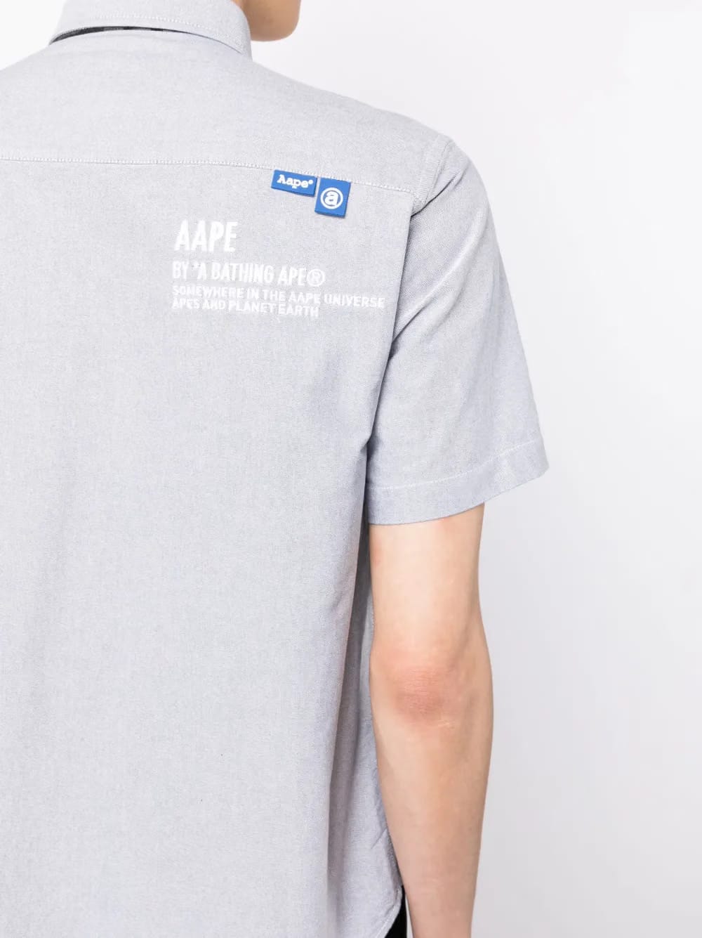 camouflage-print logo-patch shirt