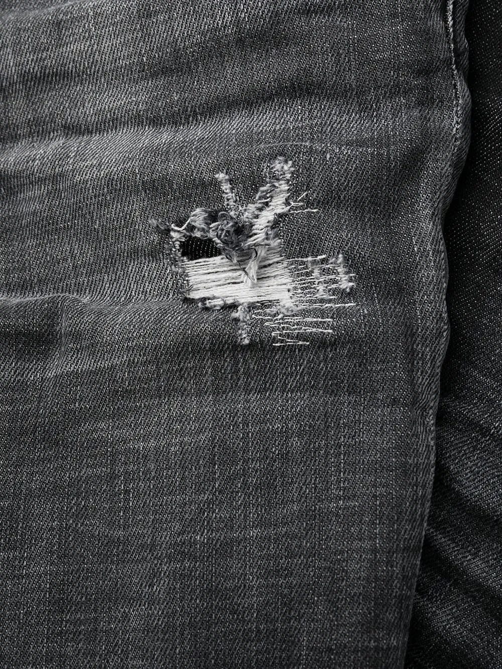 distressed-effect logo-patch denim jeans