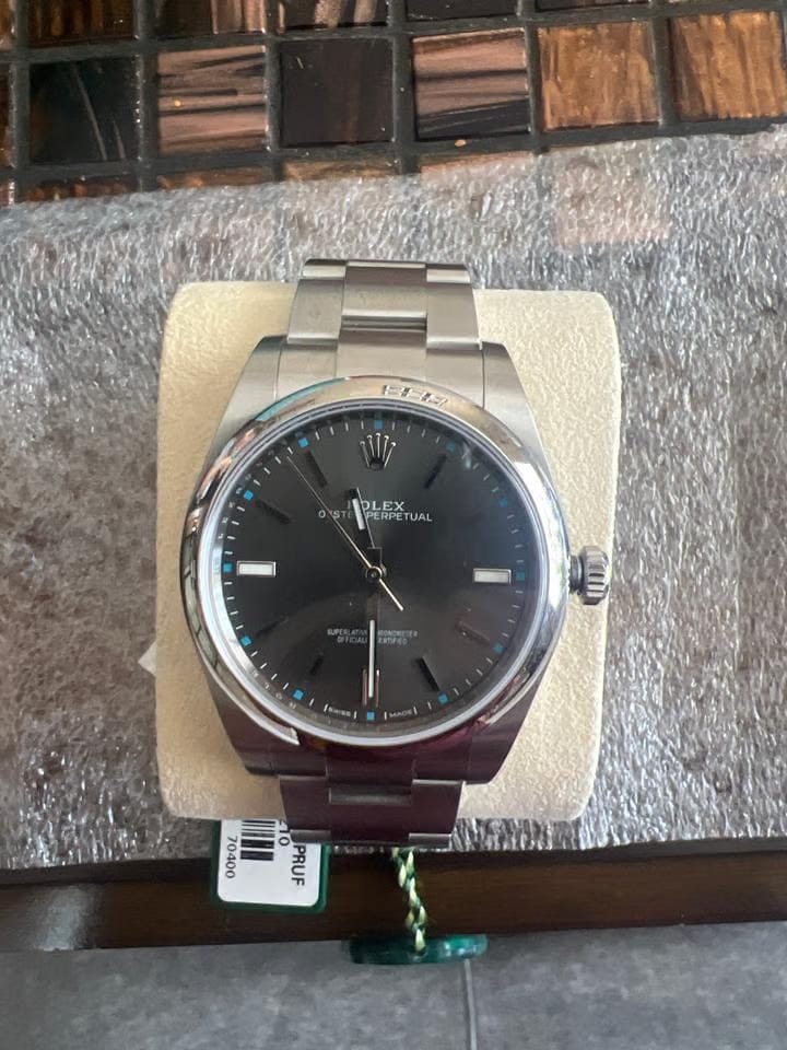 Rolex | Oyster Perpetual | 114300 | Steel | 39 mm | Steel | Red | Automatic