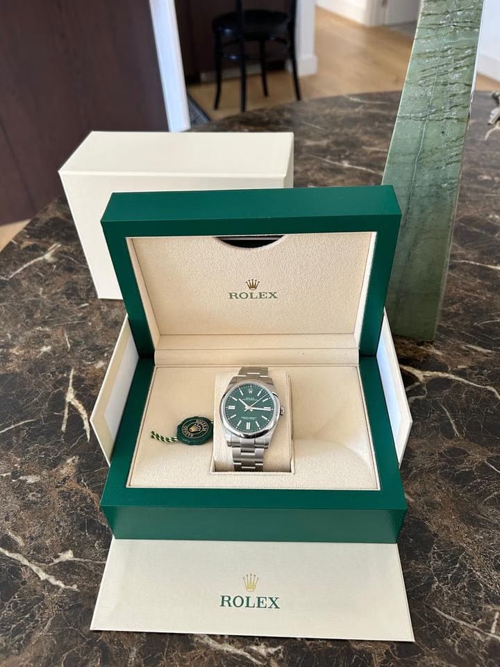 Rolex | Oyster Perpetual | 1100 | Steel | 41 mm | Steel | Green | Automatic