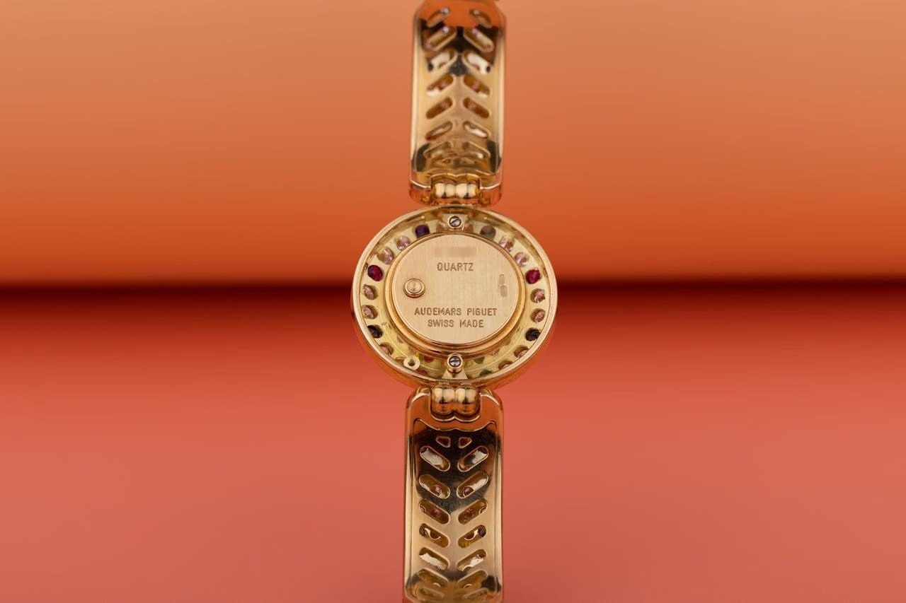 Audemars Piguet Unworn Extremely Rare Lady Wristwatch | Unique Pave Diamonds Emeralds Sapphires and Rubies | 18k Yellow Gold