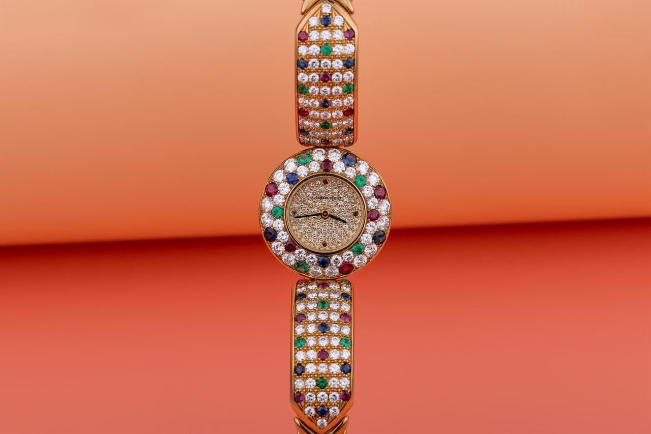 Audemars Piguet Unworn Extremely Rare Lady Wristwatch | Unique Pave Diamonds Emeralds Sapphires and Rubies | 18k Yellow Gold