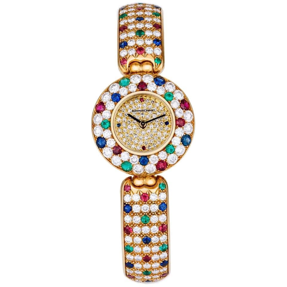 Audemars Piguet Unworn Extremely Rare Lady Wristwatch | Unique Pave Diamonds Emeralds Sapphires and Rubies | 18k Yellow Gold