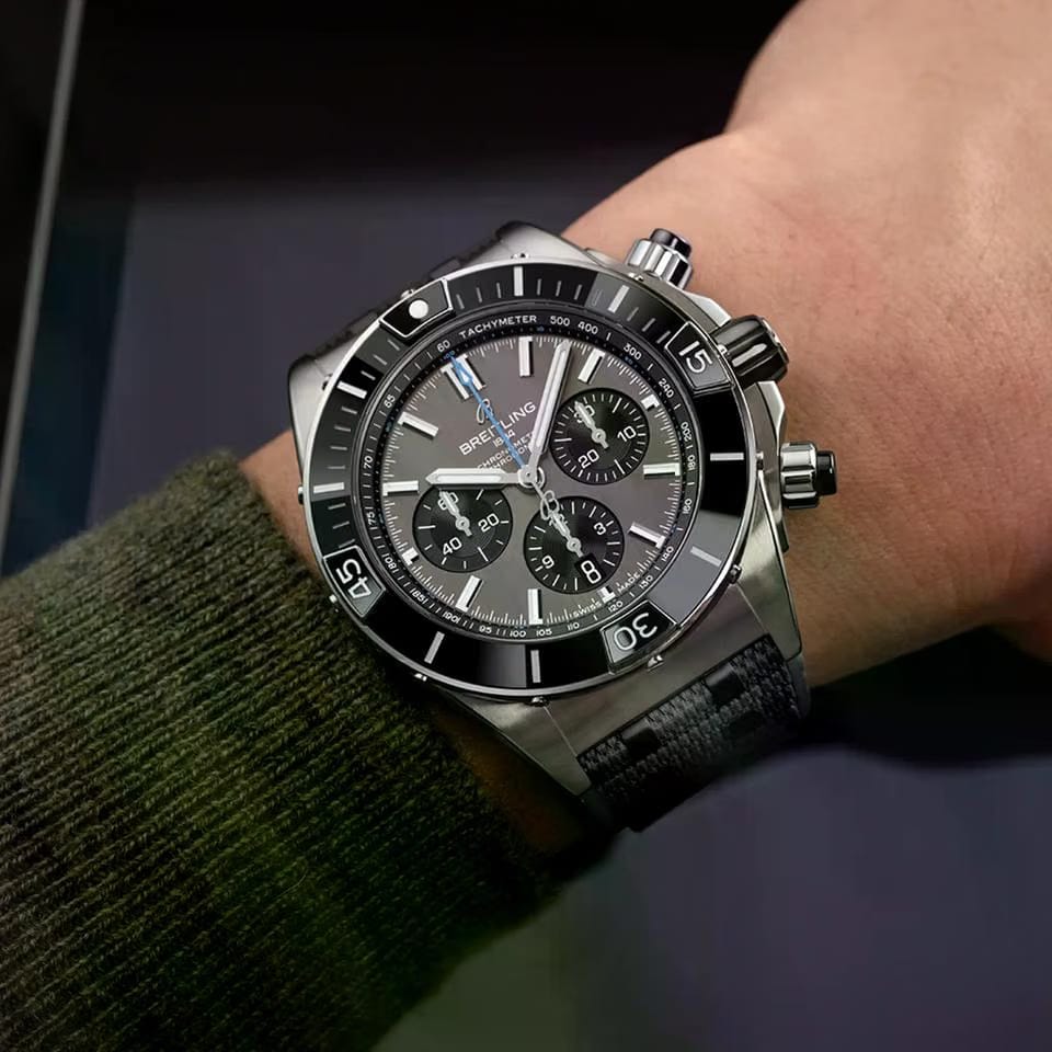 Breitling Chronomat Super Chronomat B01 44 Grey Dial Black Rubber Strap EB0136251 M1 S1 1/4th second chronograph 30-minute and 12-hour totalizers.