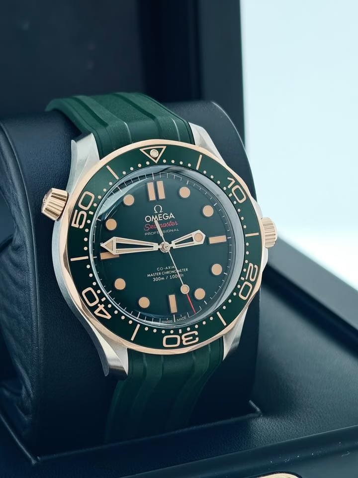 Omega Seamaster Diver 300 Mbasel one Titanium Bronze Gold On green Rubber strap 5 years international warranty