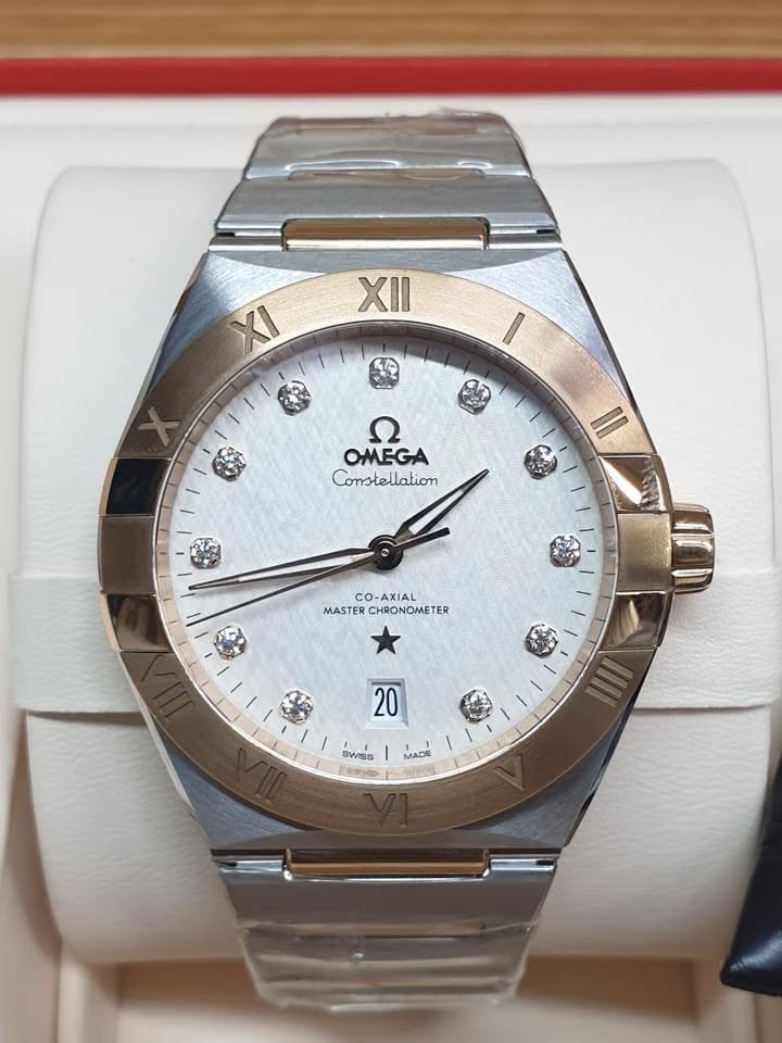 Omega Constellation Co-axial Master Chronometer 18k Rosegold and Steel Strap + Leather strap