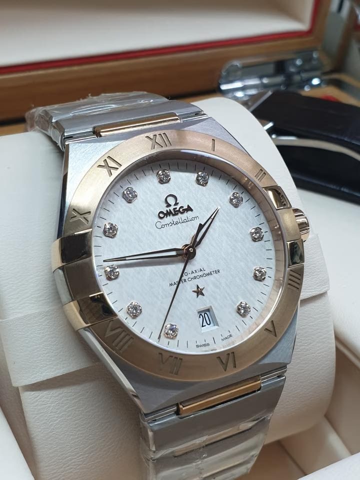 Omega Constellation Co-axial Master Chronometer 18k Rosegold and Steel Strap + Leather strap
