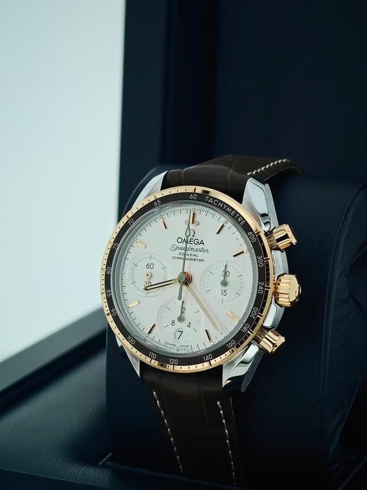 Omega Speedmasterbasel one Speedmaster 38 Co-Axial Chronograph Yellow gold leather green white dial 5 years international warranty