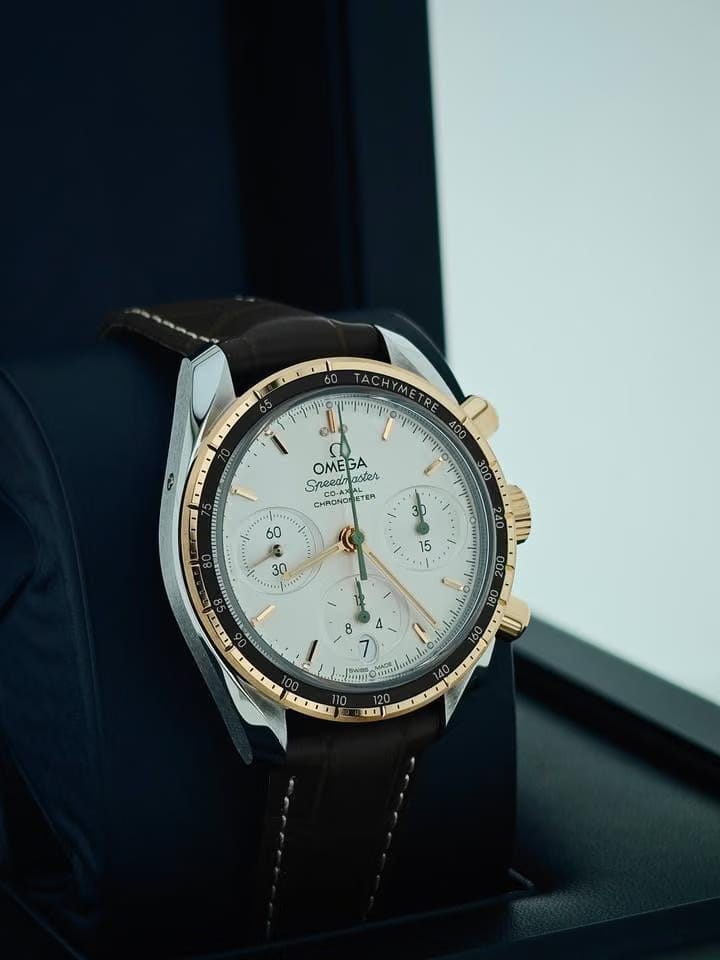 Omega Speedmasterbasel one Speedmaster 38 Co-Axial Chronograph Yellow gold leather green white dial 5 years international warranty