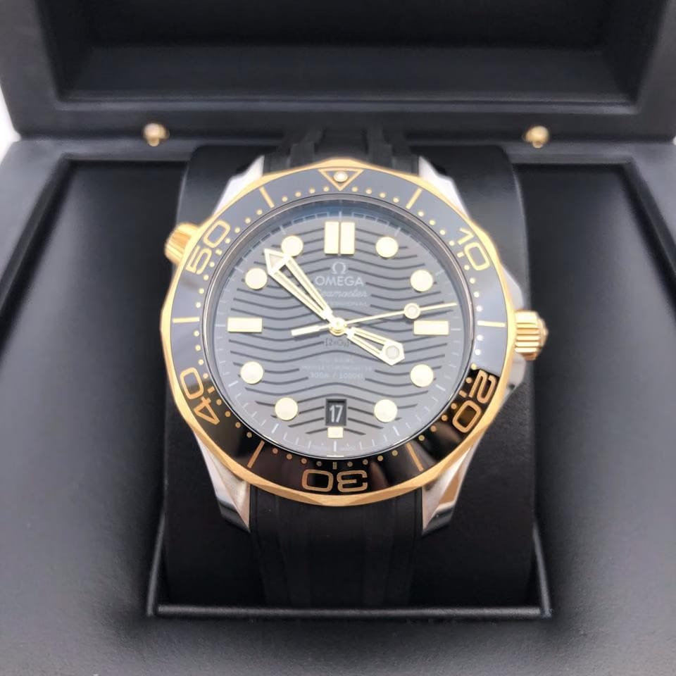 Omega Seamaster Diver 300 Mbasel one Seamaster Diver 300 M yellow gold steel black dial 42mm 5 years international warranty