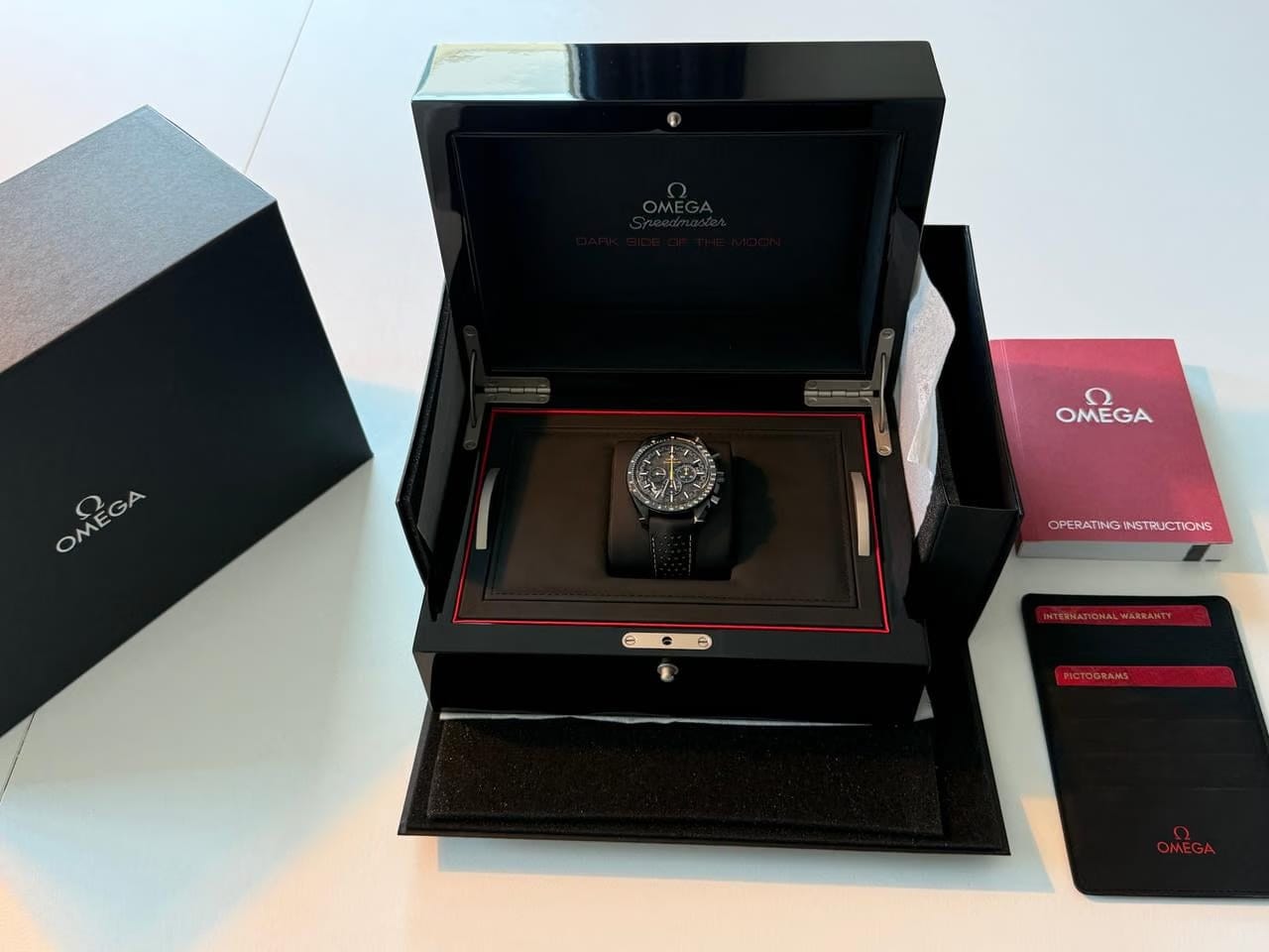 Omega Speedmaster Dark Side Of The Moon Apollo 8 Special Edition with both pin buckle & fold clasp.
