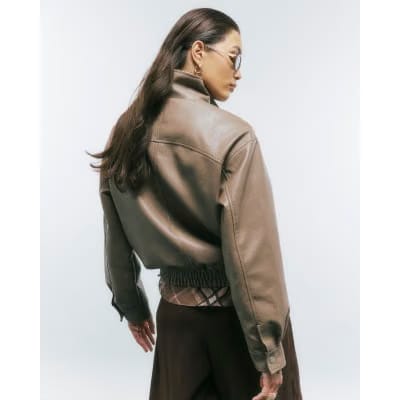 Beige Textured Faux Leather Bomber Jacket