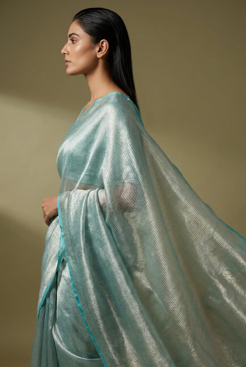 Celeste Silver Tissue Saree With Aqua Border