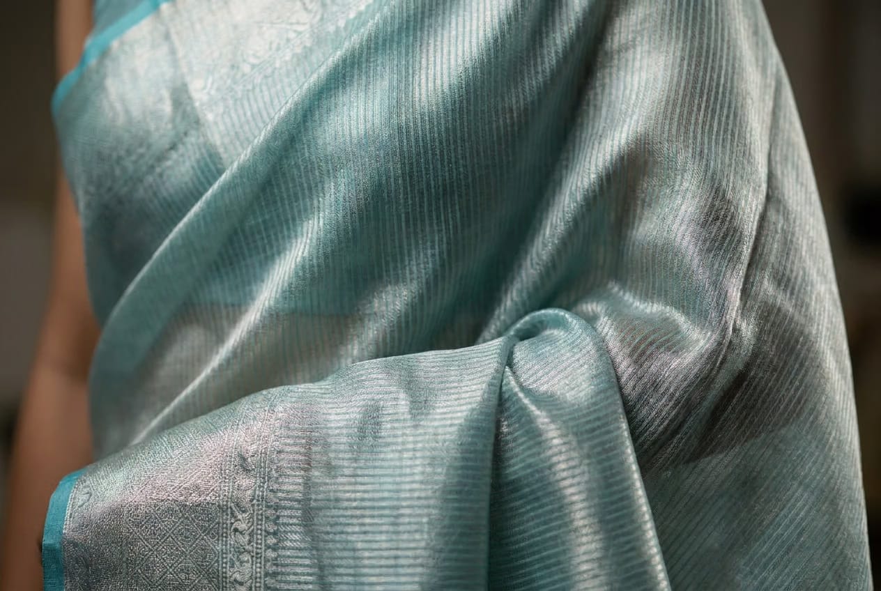 Celeste Silver Tissue Saree With Aqua Border