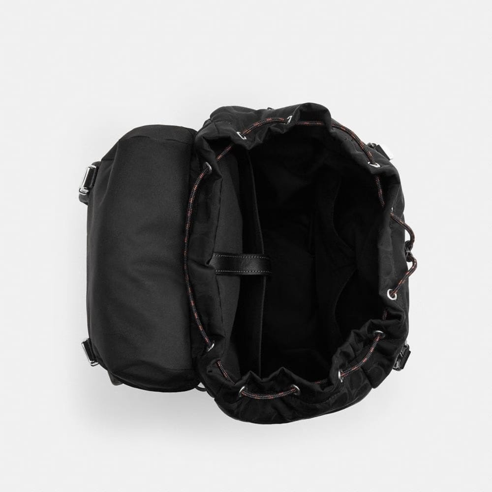Logan Backpack In Signature Nylon With Charms