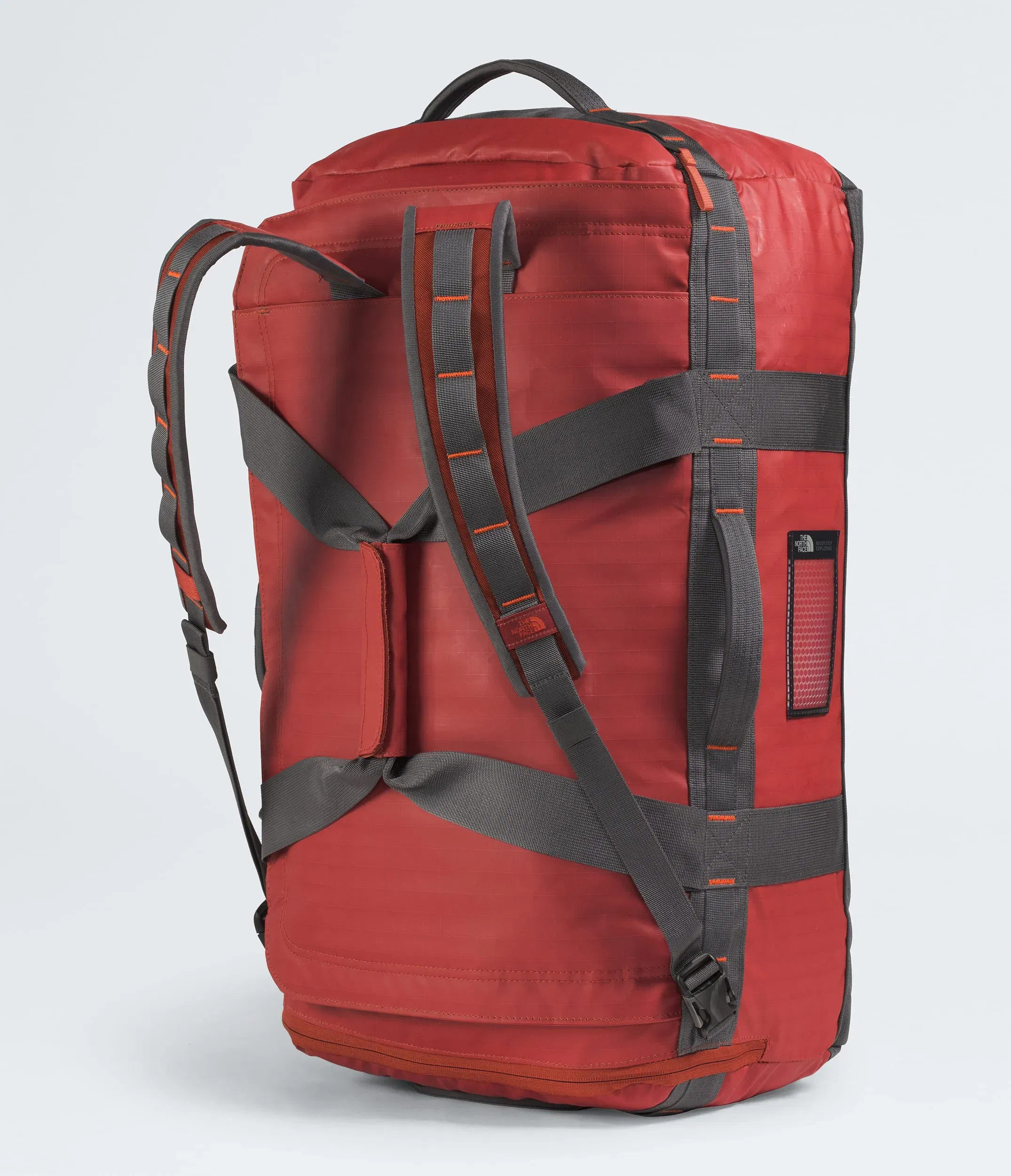 The North Face Base Camp™ Voyager Duffel—62L Iron Clay-Anthracite Grey-Lava Red