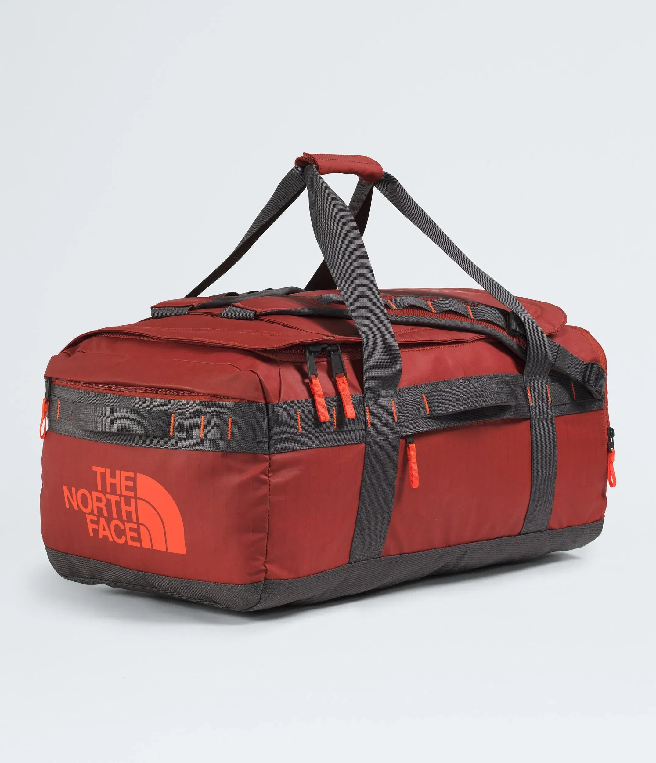 The North Face Base Camp™ Voyager Duffel—62L Iron Clay-Anthracite Grey-Lava Red