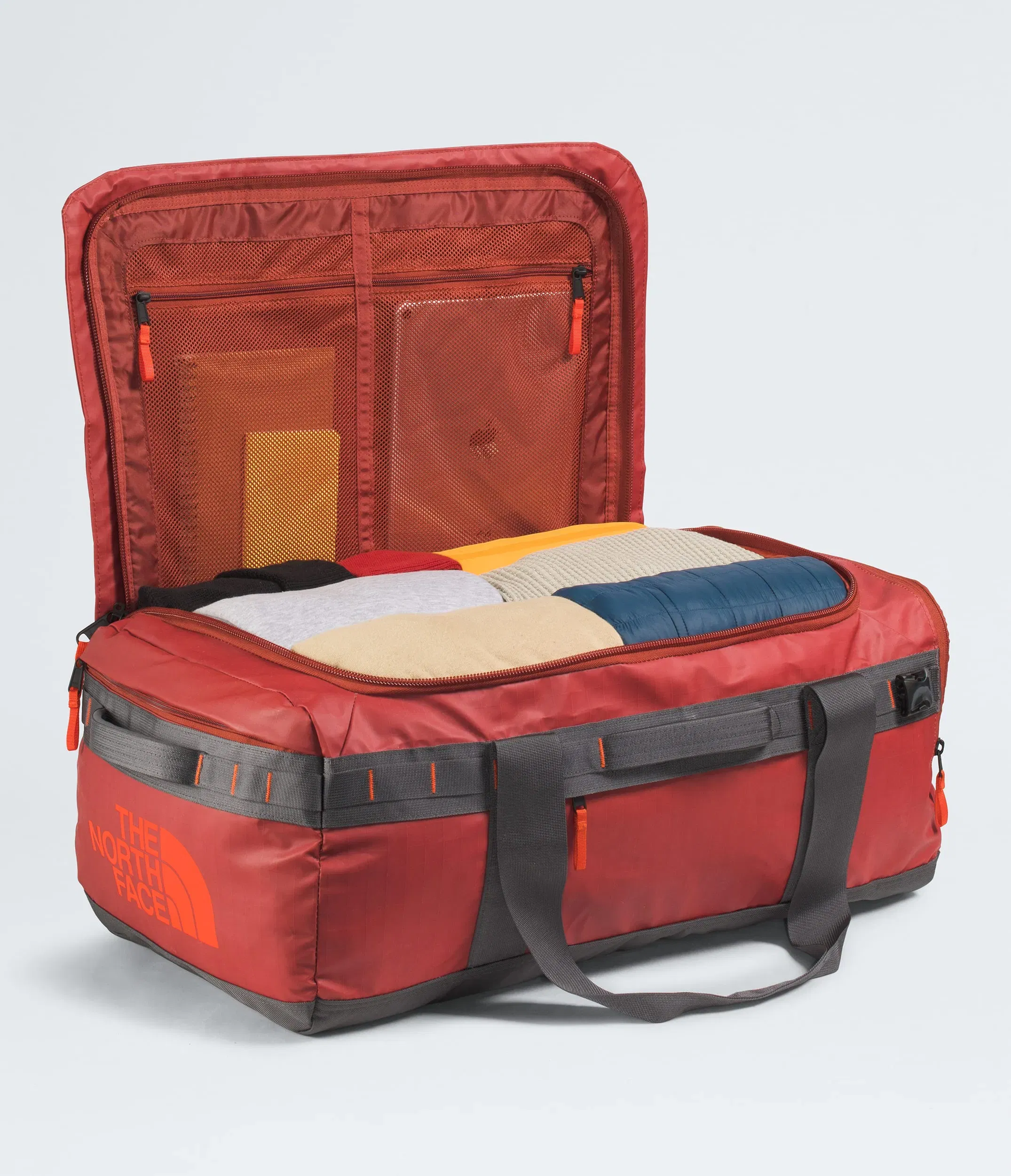 The North Face Base Camp™ Voyager Duffel—62L Iron Clay-Anthracite Grey-Lava Red