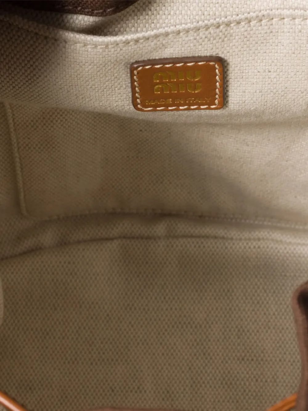 leather-trimmed canvas backpack