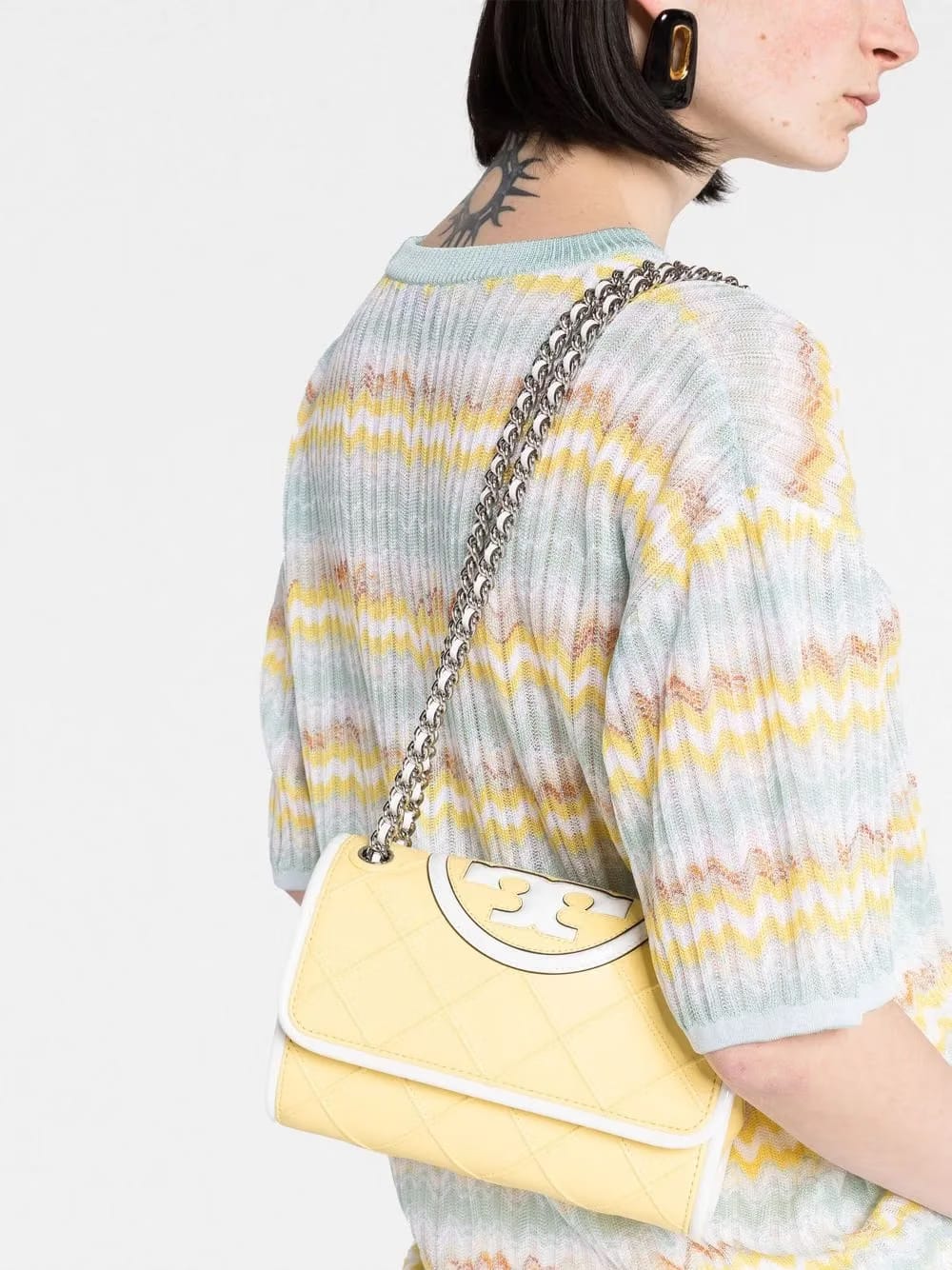 embossed and quilted cross-body bag