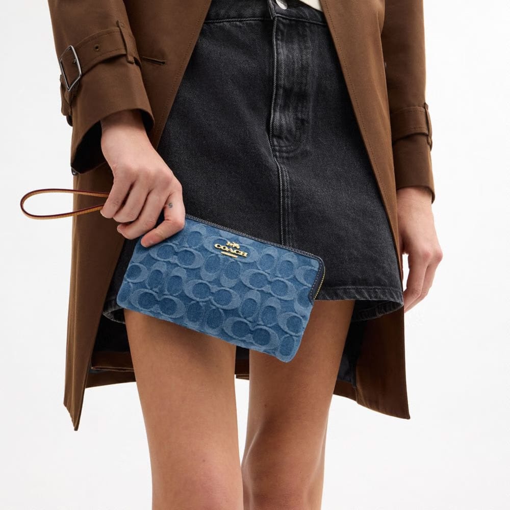 Coach Large Corner Zip Wristlet In Signature Denim Gold Indigo