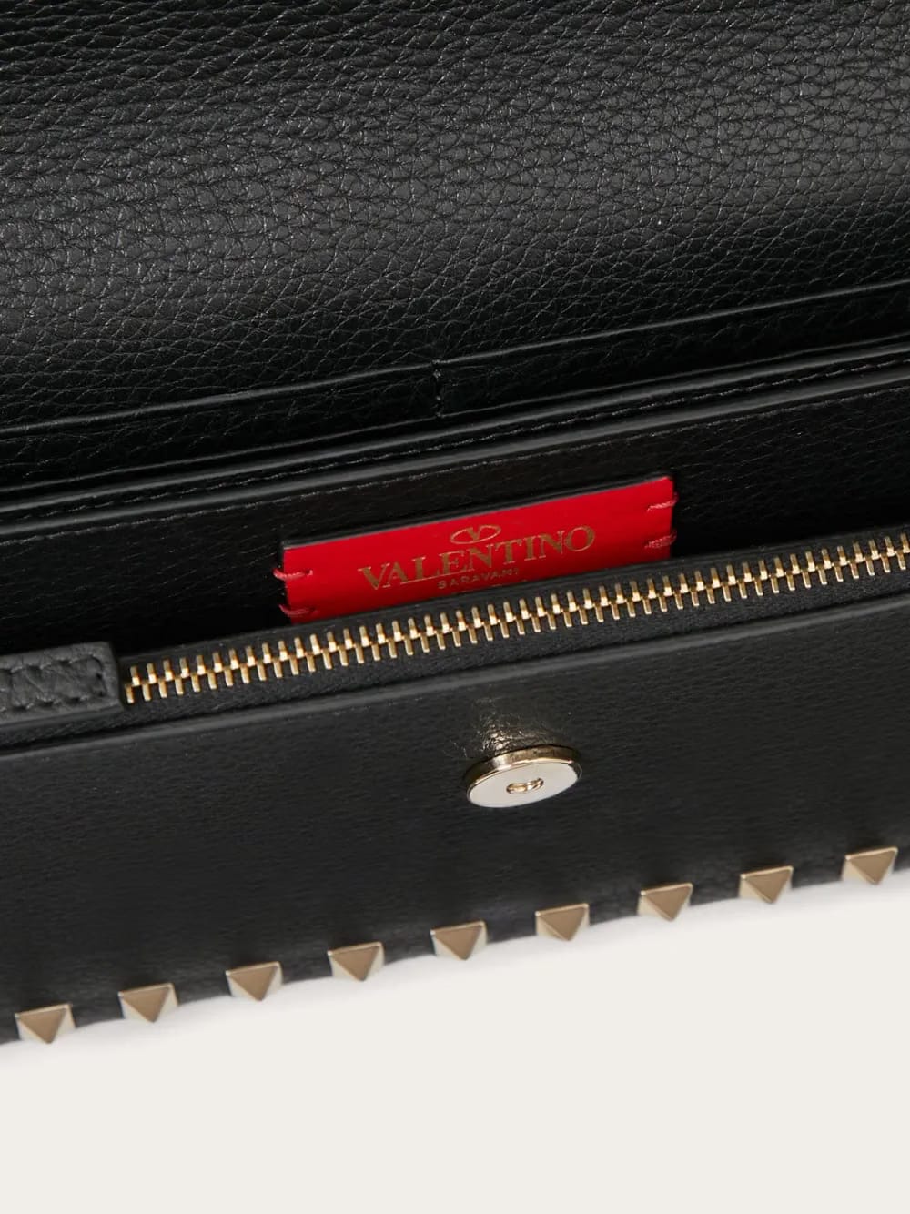 Rockstud leather clutch bag