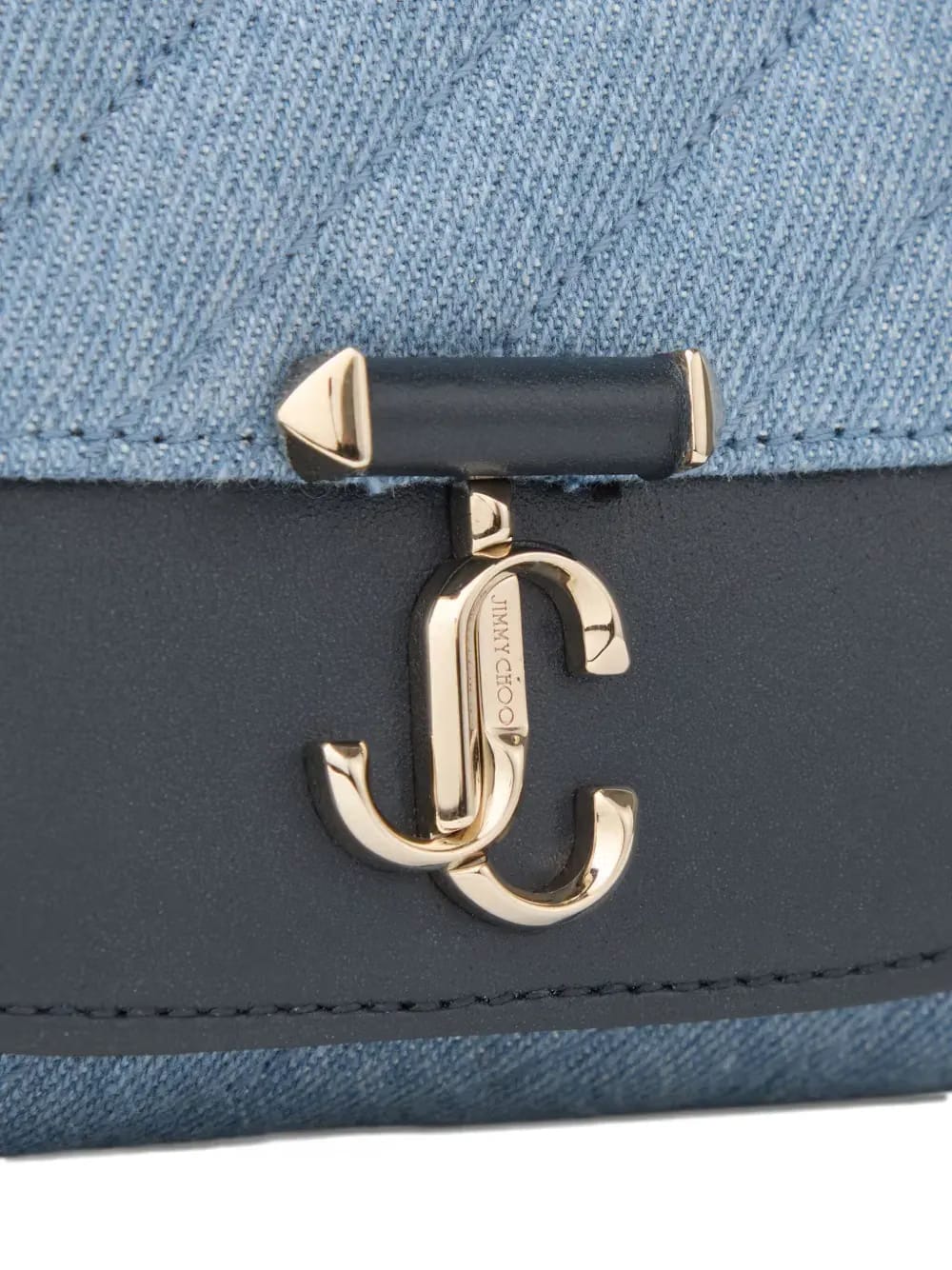 Curve quilted clutch bag