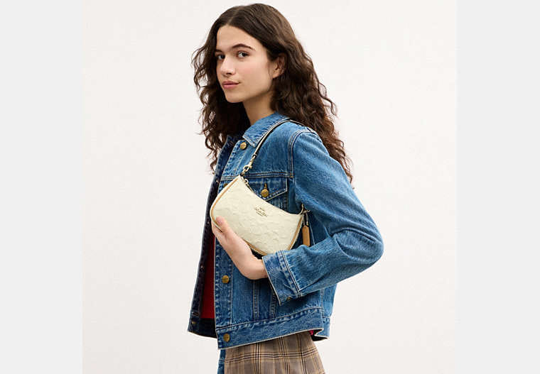 Teri Mini Crossbody Bag In Signature Leather