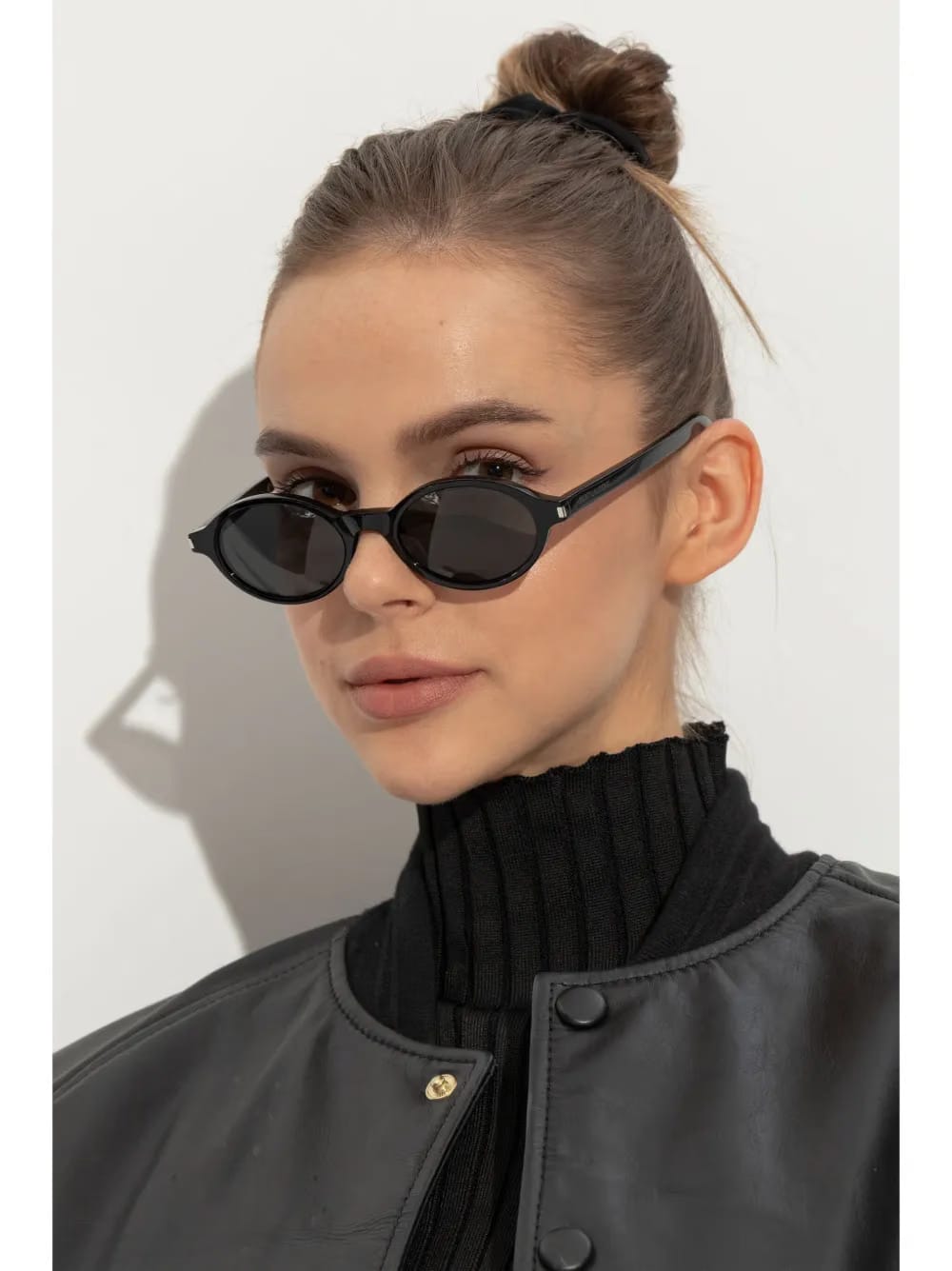 tinted oval-framed sunglasses
