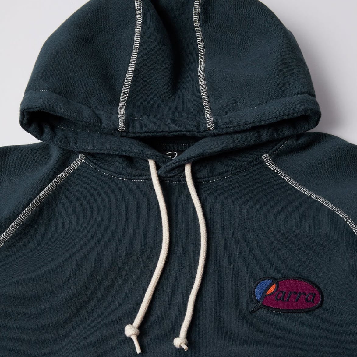 BY PARRA CIRCLED SCRIPT LOGO HOODED SWEATSHIRT - BLUE
