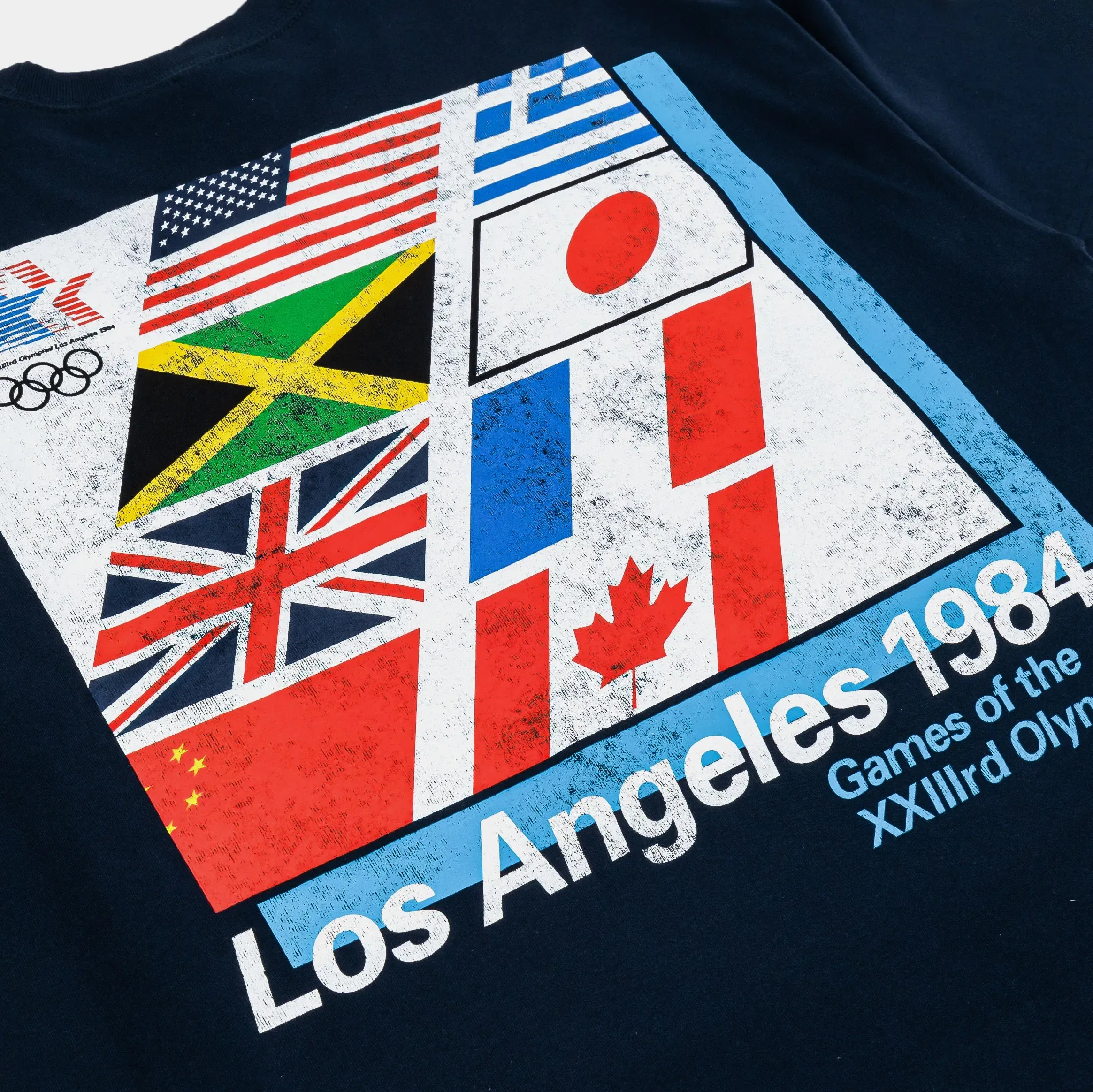 OUTERSTUFF 1984 Los Angeles Emblem Flag Mens Short Sleeve Shirt (Navy/White)