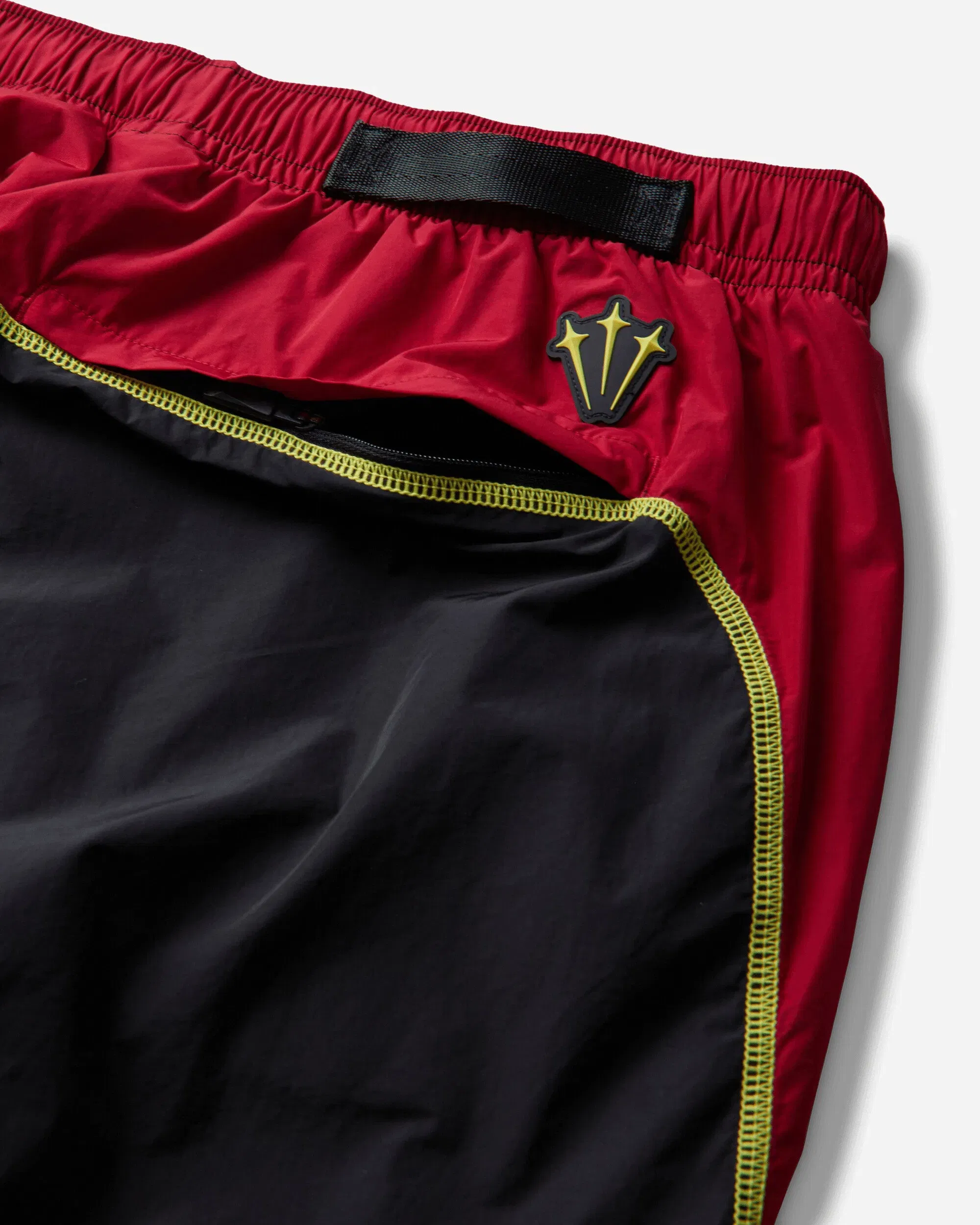 Nike Canada x NOCTA Woven Track Pants Black / Gym Red / Sonic Yellow