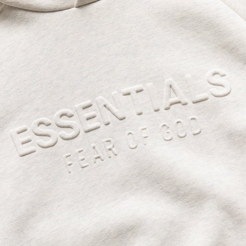 Fear of God Essentials Women's Fear Of God Essentials Embossed 90's Raglan Hoodie - Oatmeal Heather