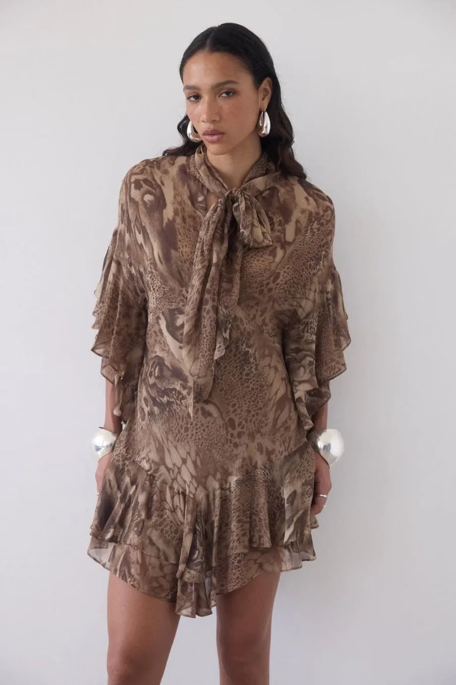 De La Vali Sol Neck Tie Ruffle Mini Dress in Brown