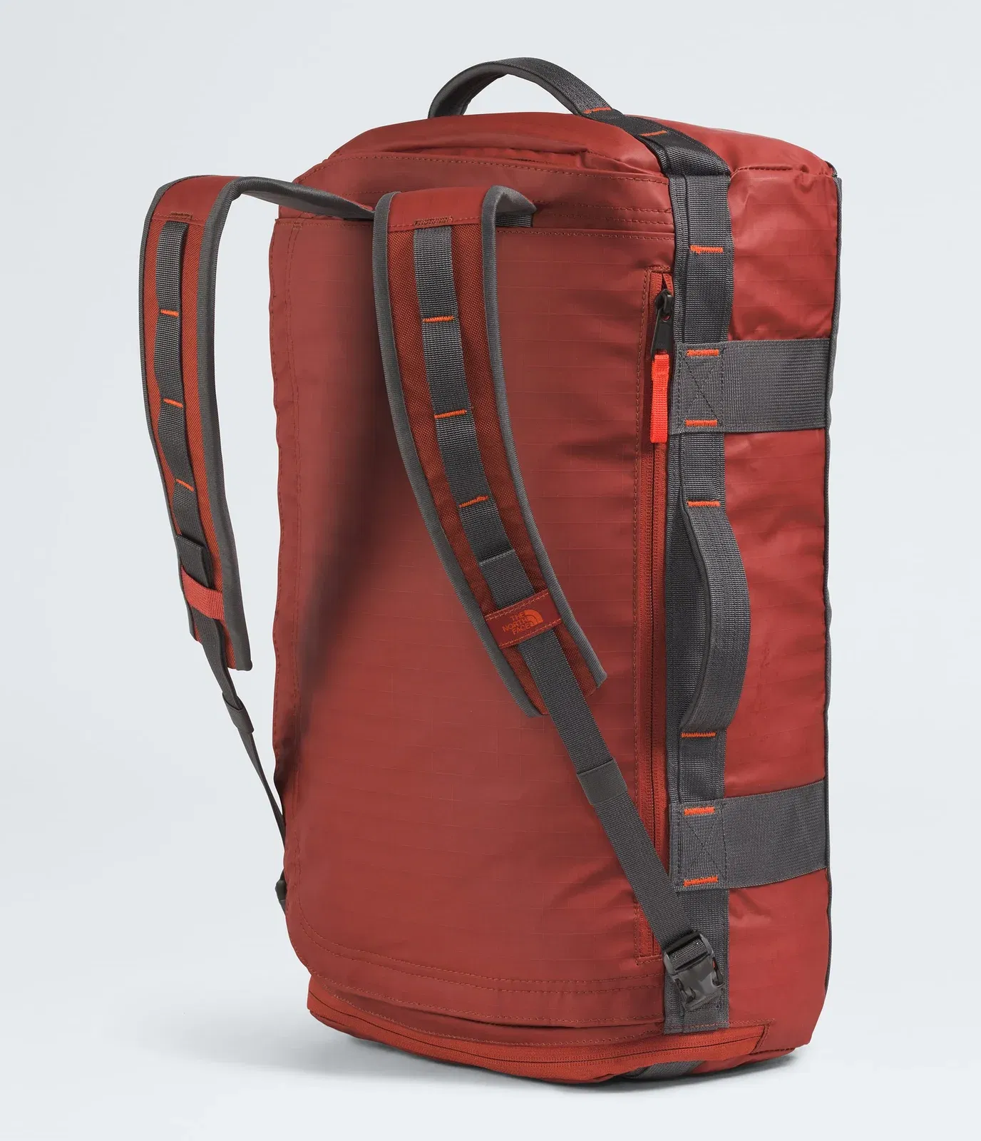 The North Face Base Camp™ Voyager Duffel—32L Iron Clay-Anthracite Grey-Lava Red