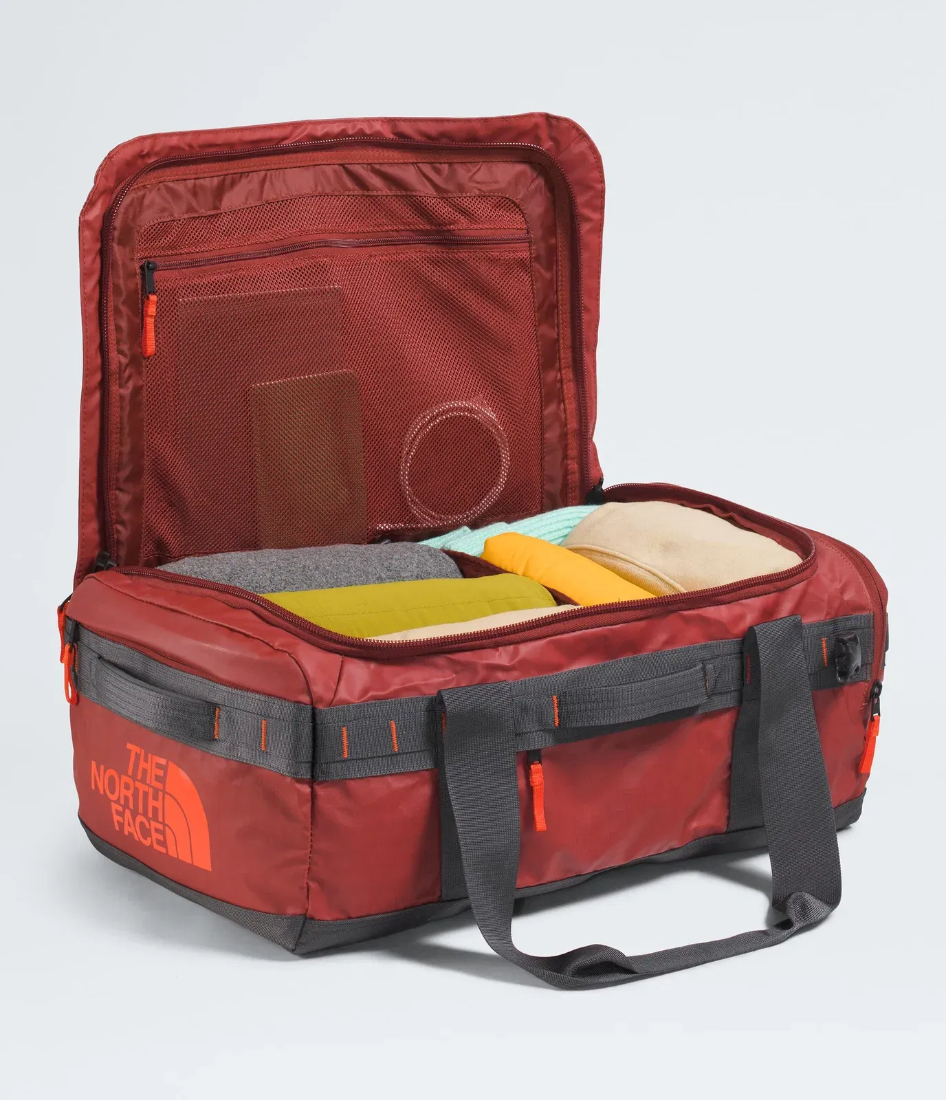 The North Face Base Camp™ Voyager Duffel—42L Iron Clay-Anthracite Grey-Lava Red