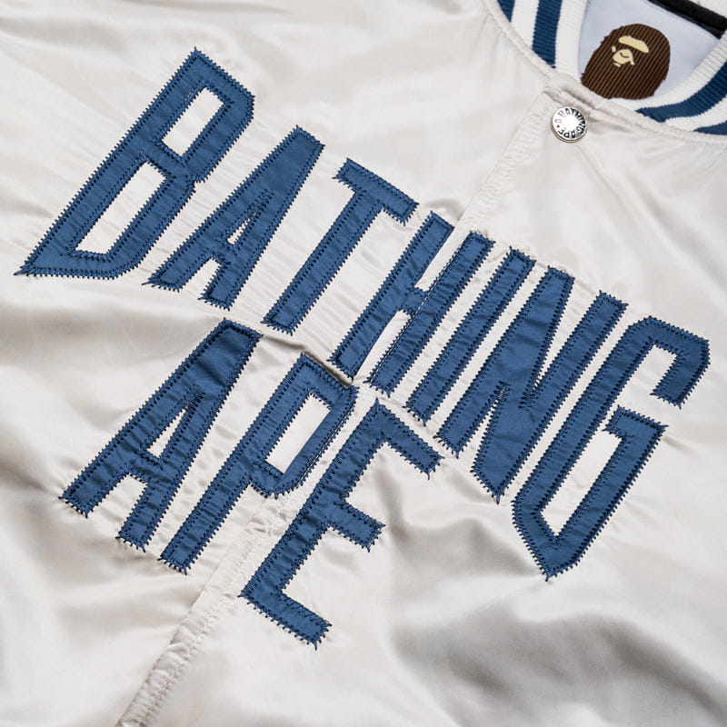BAPE A Bathing Ape Solid Camo NYC Logo Varsity Jacket - Ivory