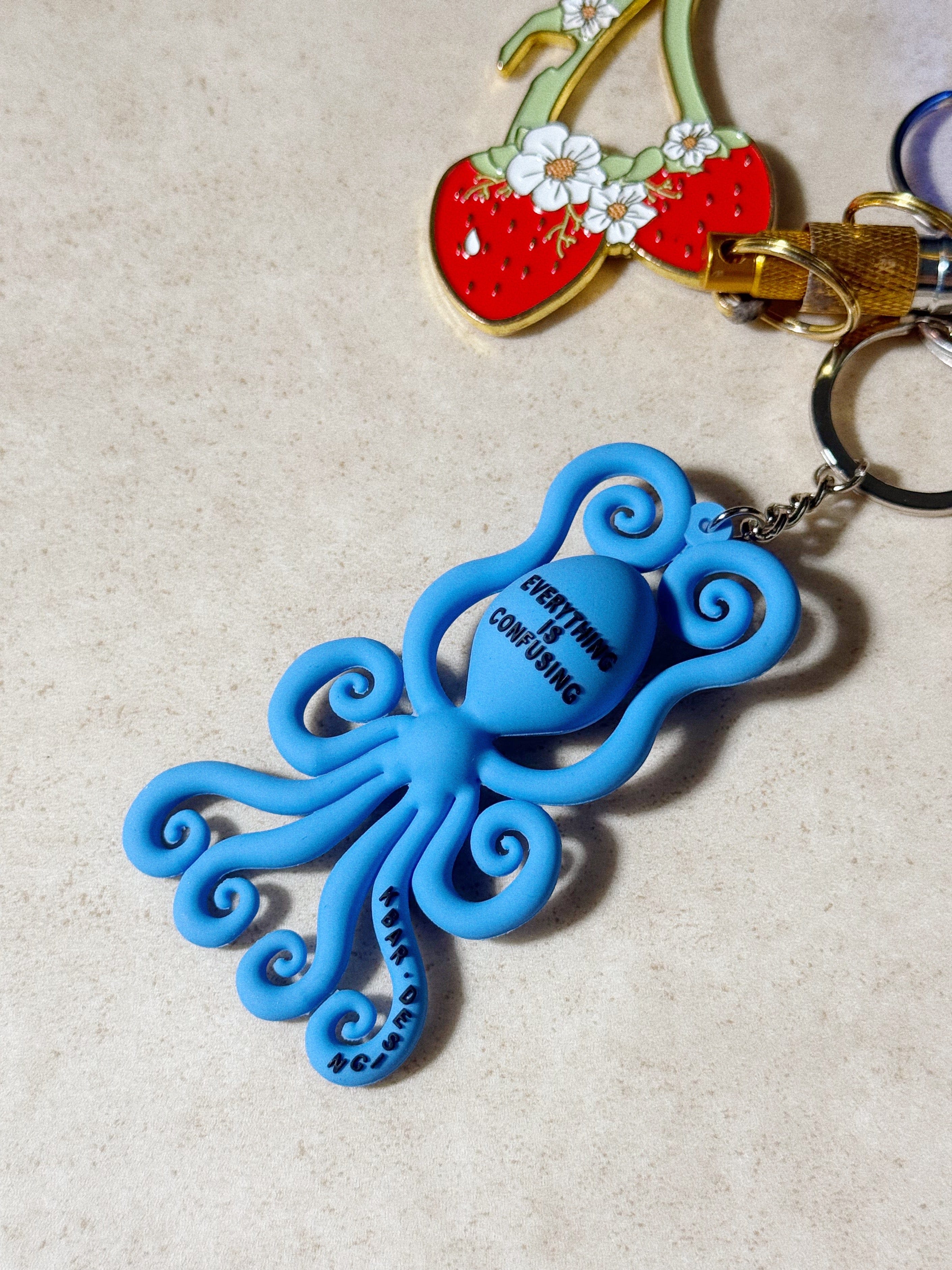 KBar Design KBAR X UN:IK 'Everything is Confusing' Rubber Keyring