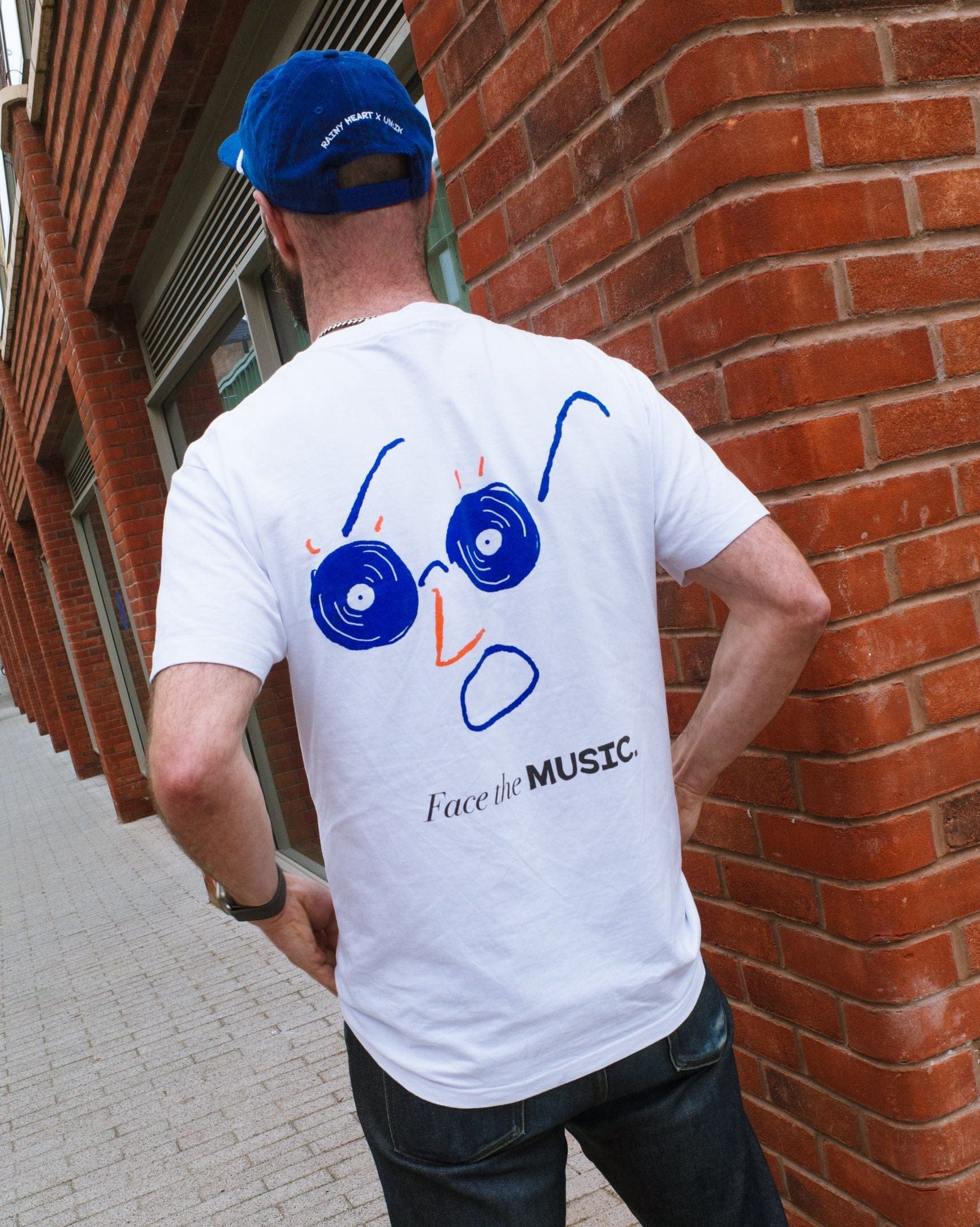 Rainy Heart x UN:IK 'Face the Music' Tee - White