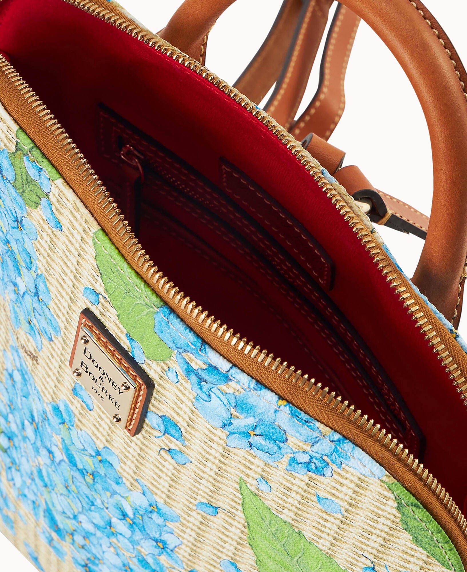 Dooney & Bourke Hydrangea Basketweave Zip Pod Backpack